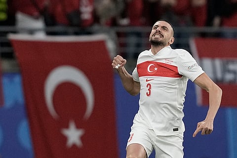 Merih Demiral celebrates scoring a goal against Austria